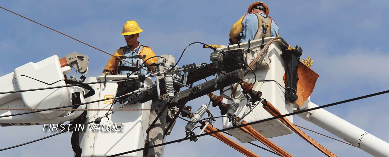 Freeport Electric lineworkers servicing power lines
