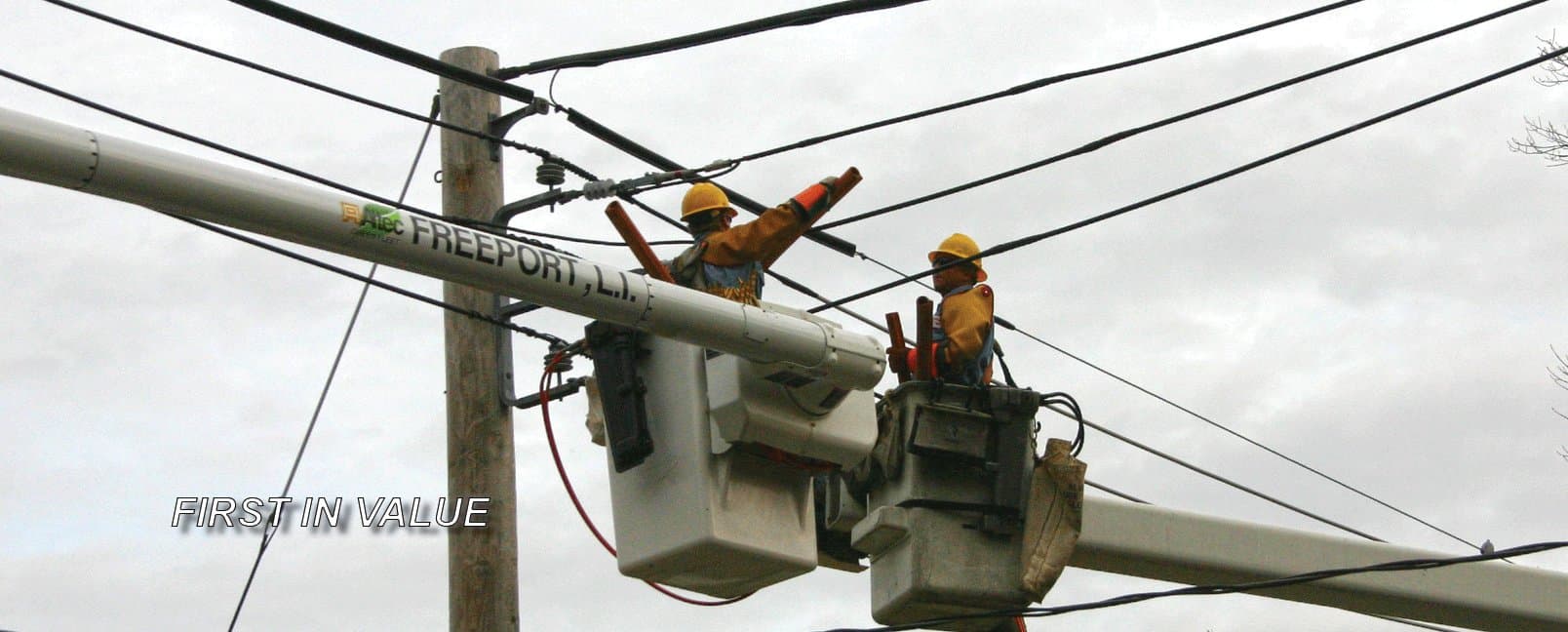 Freeport Electric crew working from a bucket truck